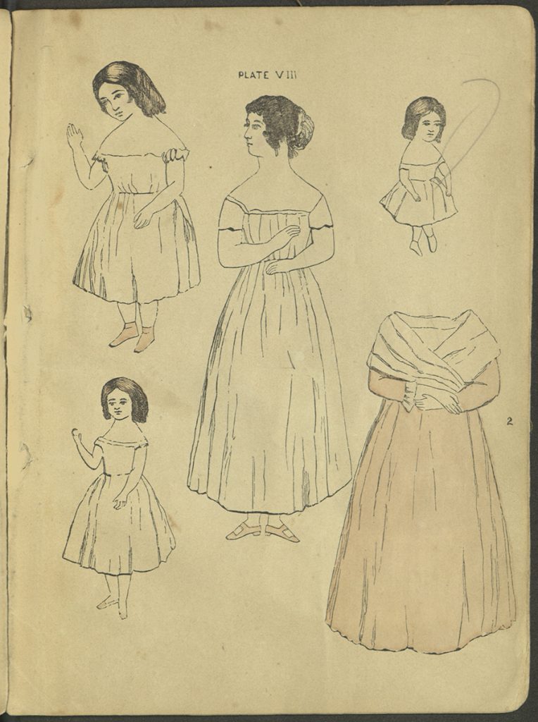 Plate VIII. Four dolls, of varying ages, and one garment